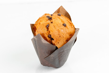 muffin cup cake closeup. With chocolate chips and fruit filling