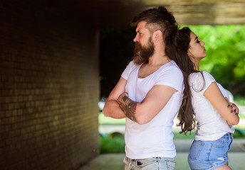Naklejka premium Couple in love can not find same point of view. Couple problems relationship. Girl attractive brunette bearded hipster man stand back to back porch underground crossing. Couple has disagreements
