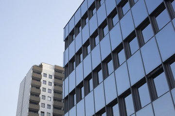 Two skyscrapers, one behind another