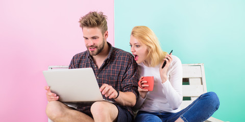 Modern occupation. Couple surfing internet posting content social network. Shocking content. Couple content creators work with laptop and smartphone. Man girl create content blog social network