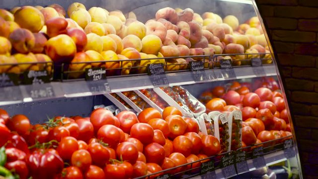 Peaches, kiwi, tomatoes and other vegetables and fruits are cooled on the shelf