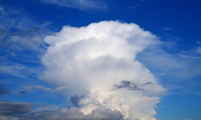 Fototapeta na wymiar Unusual white cloud on the blue sky background