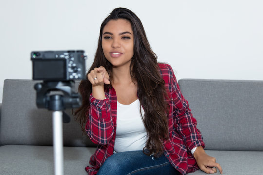 Latin American Vlogger Girl Pointing At Camera In Video Blog