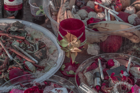 Roadside Roadside Offering Candombl&eacute;/UmbOffering Candombl&eacute;/Umbanda Religion with roses, cigarrettes and licquor in S&atilde;o Paulo Brazil.