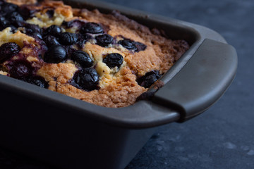 Edge of a Blueberry Loaf Cake in a Cake Tin