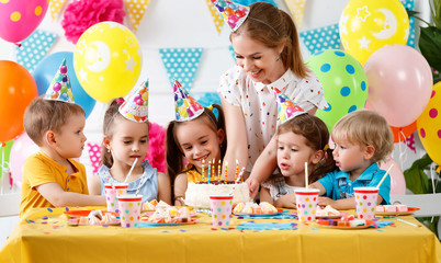 children's birthday. happy kids with cake