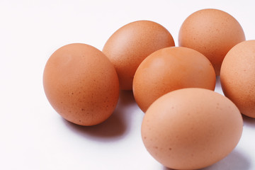 Six brown eggs