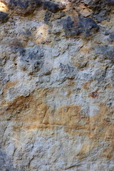 Natural background, ancient wall of the medieval city, the wall of an ancient temple in Prague, stone masonry test with cement