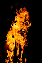 Flame of fire with sparks on a black background