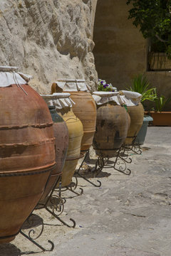 Rustic handmade ceramic clay brown terracotta pots souvenirs at street handicraft