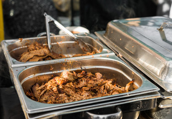 Beef and chicken marinated barbecue meat cooking at a street food market