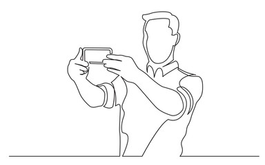 continuous line drawing of standing man making selfie with his mobile phone