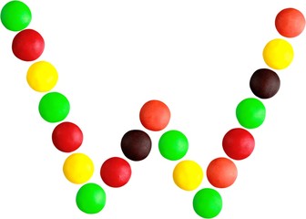 Multicolored candy spelling out the letter 