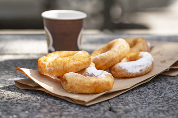 Doughnuts with sugar powder and coffee. Street food