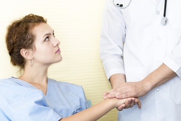 Medical professionals caucasian man reassuring and discussing with young woman worry patient.Close up and copy space.