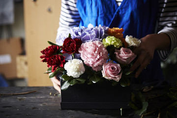 Woman making flower arrangement 