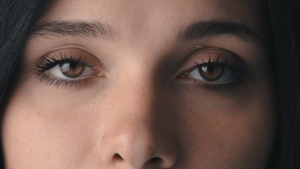 Beauty Macro Close-up Brown woman's eyes blinking - Powered by Adobe