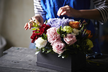 Woman making flower arrangement 