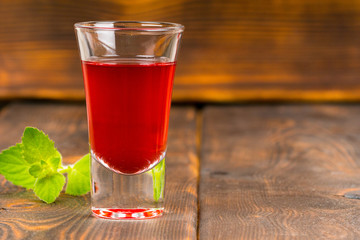 raspberry refreshing drink on wooden table