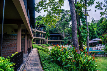 resort building in green tree garden with swimming pool at Samed Hideaway Resort Samed island rayong thailand