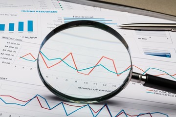 Magnifying Glass on Business Graphs and Charts