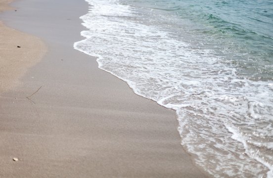 Closeup of Wave of the Sea on a Beach