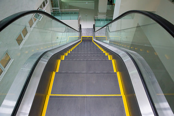 modern escalator in shopping center. Escalator at an airport with no people. escalators in symmetry...