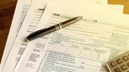 United state 1040 individual tax return form with pen