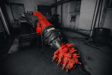 Equipment in underground mine for extraction and crushing of iron ore coal harvester.
