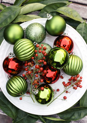 Colorful and festive Christmas ornaments on a plate