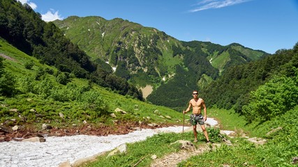 Man stands on glacier in Sochi mountains