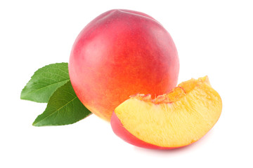 Nectarine with green leaf and slices isolated on white background.