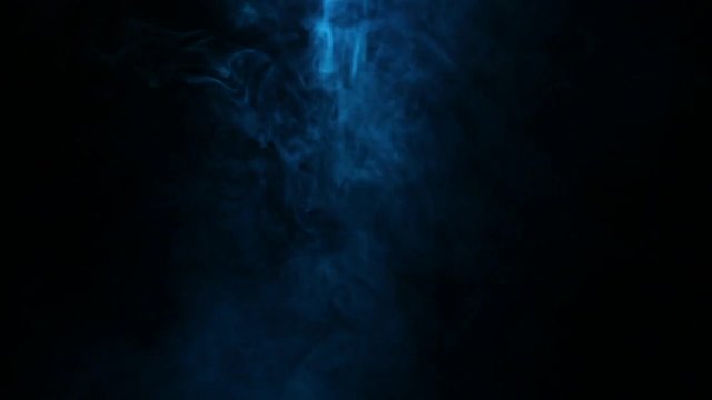 Colored cigarette smoke on a black background. Vape