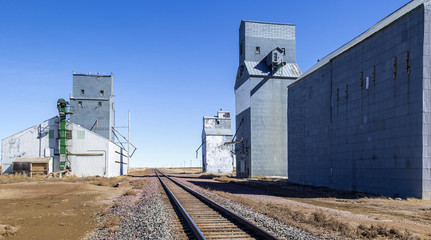 Obraz premium Grain Storage By Railway Tracks