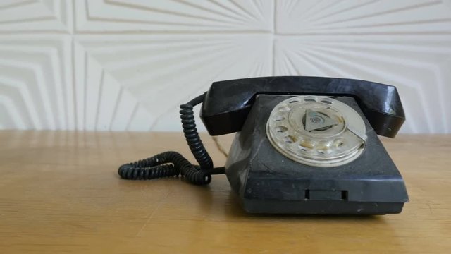 Slider shot of vintage style telephone. The old telecommunication technology
