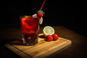 Fresh cocktail on a black background. Alcoholic cocktail on a black background. Fruit with a cocktail. Non-alcoholic cocktail. Mix of cocktails on a black background. 