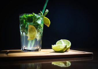 Fresh cocktail on a black background. Alcoholic cocktail on a black background. Fruit with a cocktail. Non-alcoholic cocktail. Mix of cocktails on a black background. 