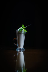 Coffee drinks on a black background. Coffee on a black table. Cold coffee. Latte. Cappuccino. Espresso. Coffee cocktails. Milkshakes. Whipped cream. Barista