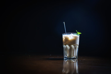Coffee drinks on a black background. Coffee on a black table. Cold coffee. Latte. Cappuccino. Espresso. Coffee cocktails. Milkshakes. Whipped cream. Barista