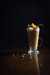 Coffee drinks on a black background. Coffee on a black table. Cold coffee. Latte. Cappuccino. Espresso. Coffee cocktails. Milkshakes. Whipped cream. Barista