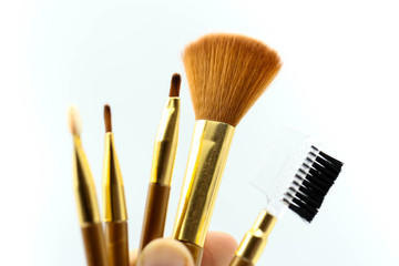 Makeup products with cosmetic on white background.