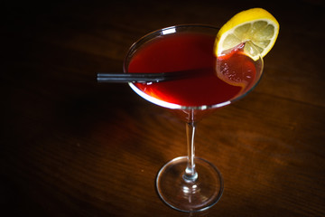 Fresh cocktail on a black background. Alcoholic cocktail on a black background. Fruit with a cocktail. Non-alcoholic cocktail. Mix of cocktails on a black background. 