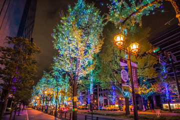 Midosuji Street, Osaka, Japan with night light illumination with many color of neon light show