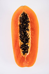 Papaya cooked in half.
