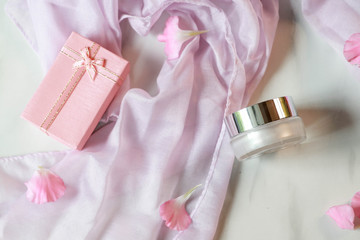 Facial cream jar on natural background