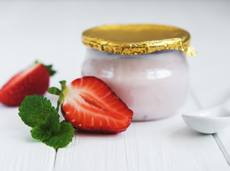Jar with strawberry yogurt