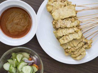 Pork, satay and dipping sauce are popular in Thailand.
