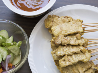 Pork, satay and dipping sauce are popular in Thailand.