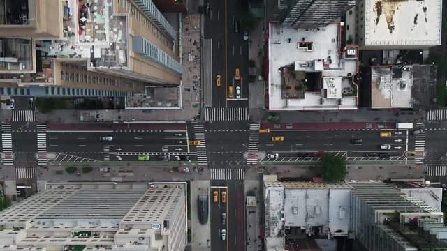 aerial flying over cars driving at intersection in Midtown Manhattan New York City NYC