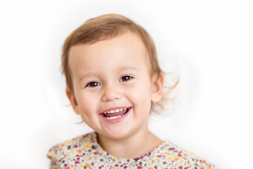 Adorable little girl smiling. on white background